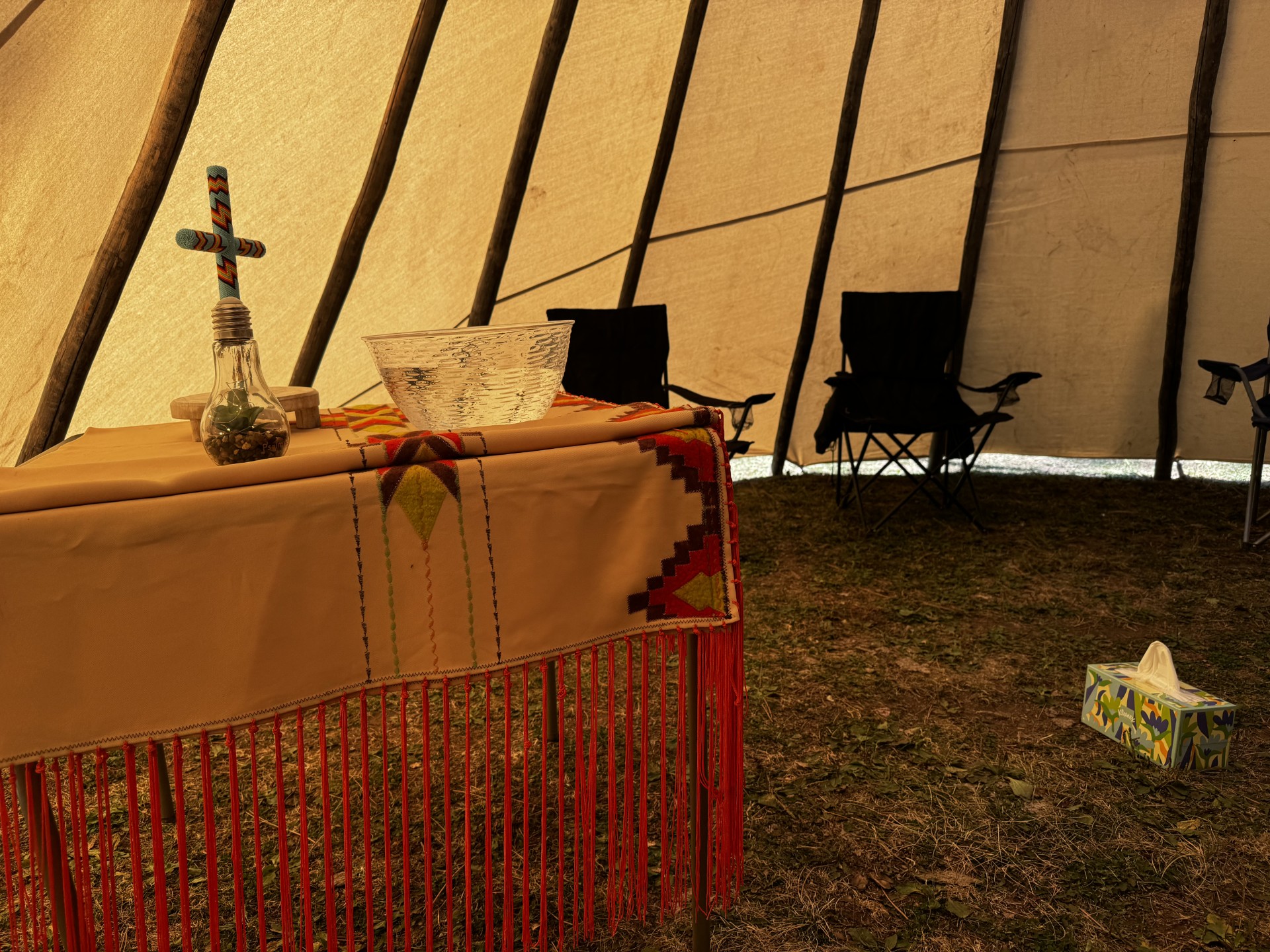 Cross on altar inside a tipi
